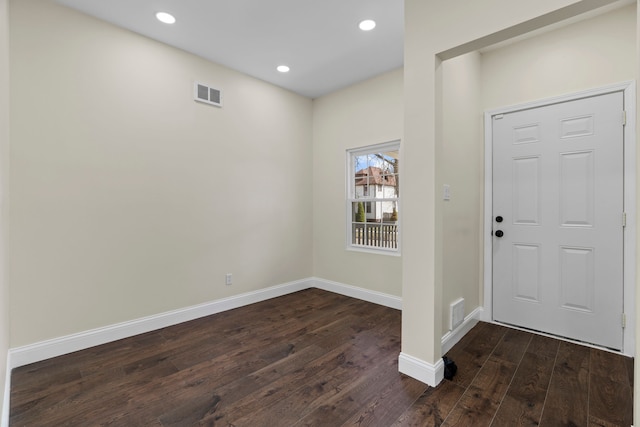 foyer entrance with visible vents, recessed lighting, baseboards, and dark wood-type flooring