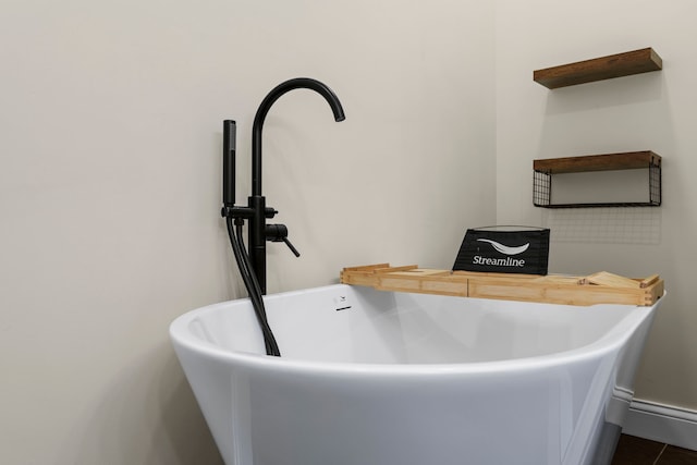 interior details featuring a freestanding bath