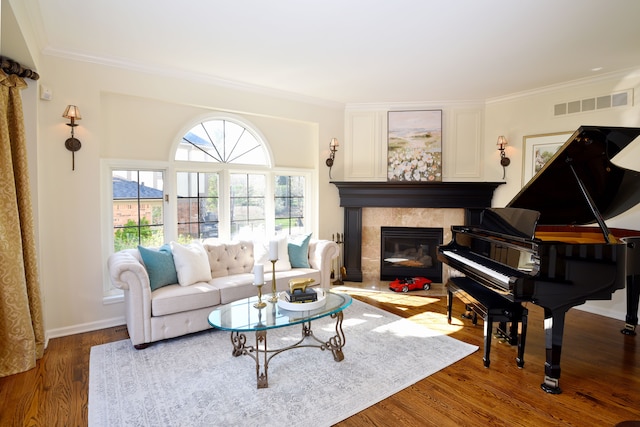 living room with visible vents, ornamental molding, and a fireplace