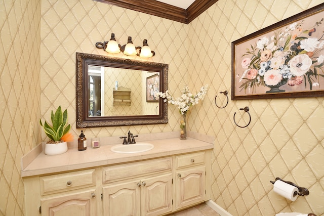 bathroom featuring vanity and ornamental molding