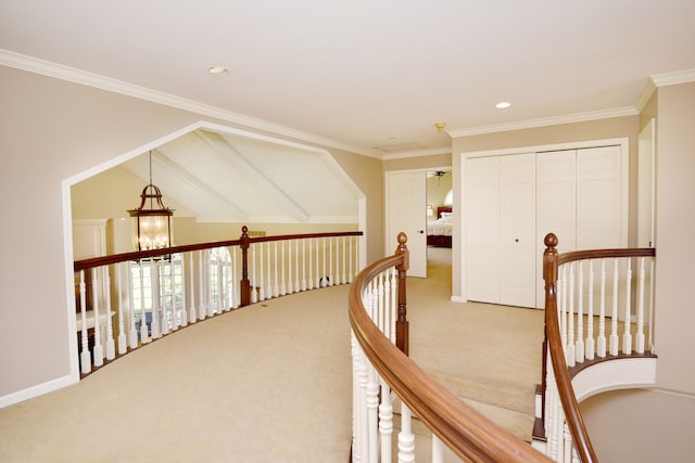 hall featuring crown molding, an upstairs landing, carpet floors, baseboards, and a chandelier