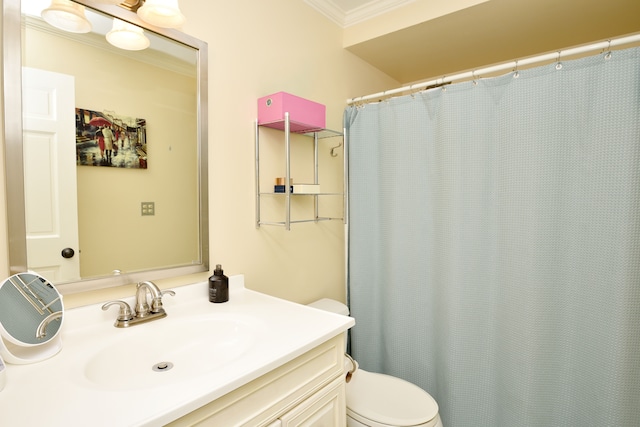 full bath with toilet, ornamental molding, and vanity