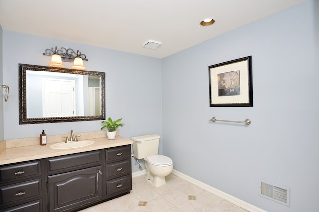 bathroom featuring tile patterned flooring, vanity, toilet, baseboards, and visible vents