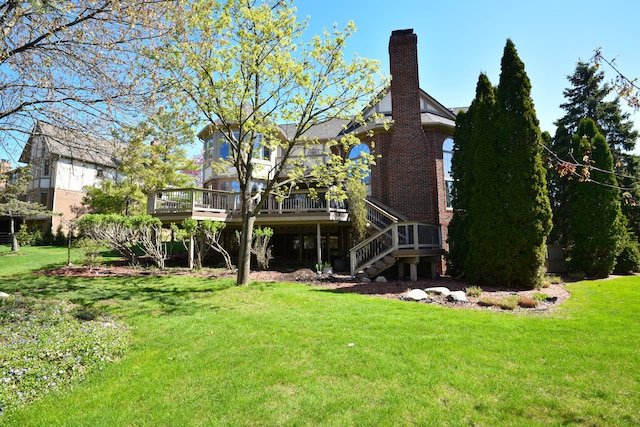 view of yard featuring a wooden deck and stairs