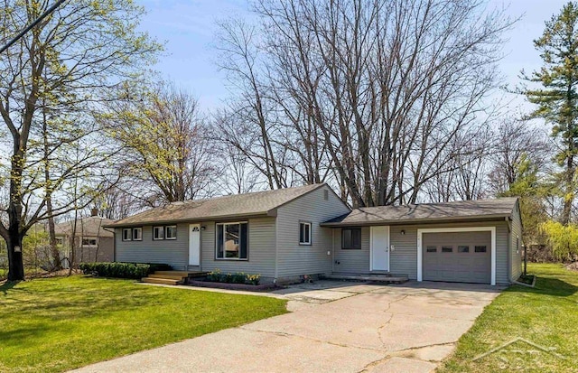 single story home featuring an attached garage, driveway, and a front yard