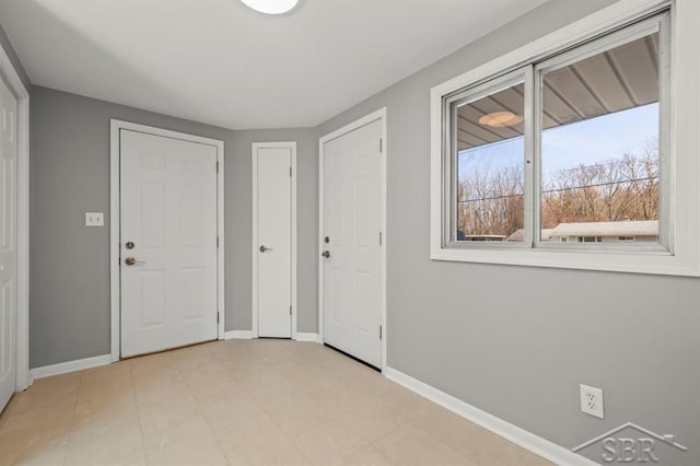 foyer entrance with baseboards