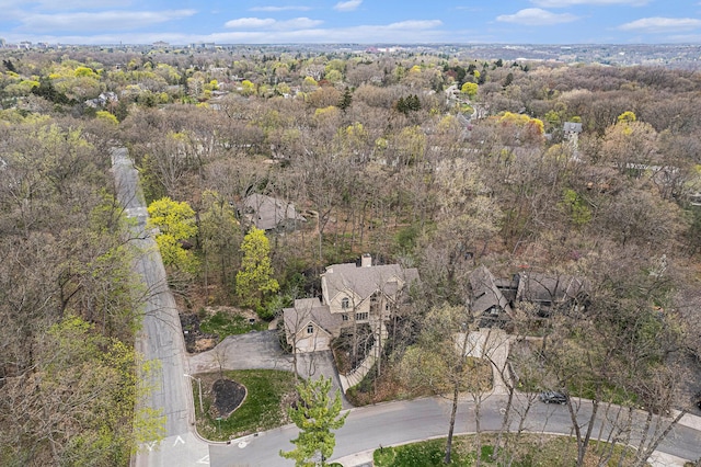 birds eye view of property with a wooded view