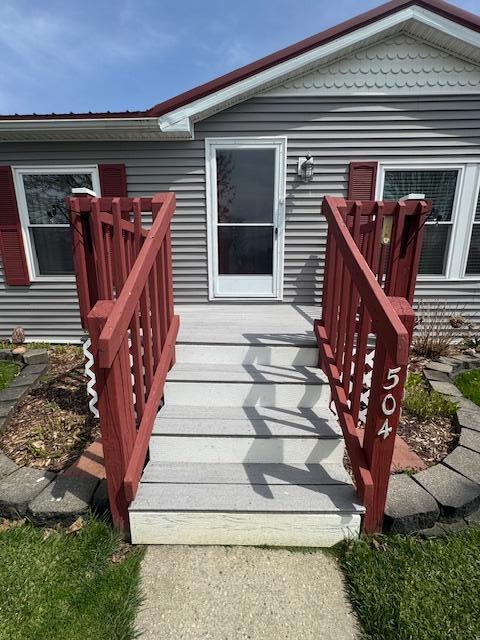 wooden terrace featuring stairway