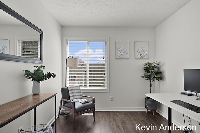 office area with baseboards, a textured ceiling, and dark wood-type flooring