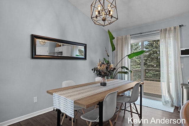 dining area featuring an inviting chandelier, baseboards, and wood finished floors