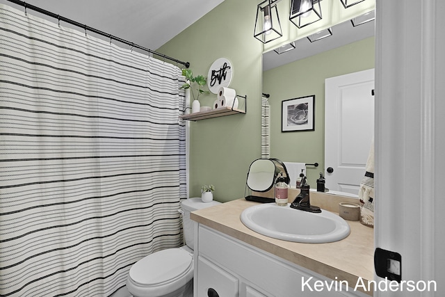 bathroom with toilet and vanity