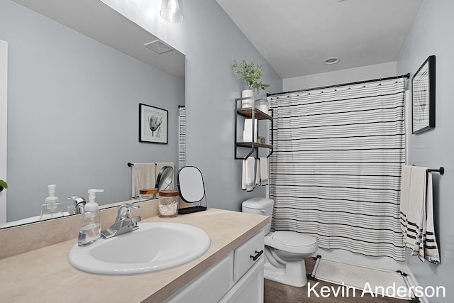 bathroom featuring vanity, curtained shower, visible vents, and toilet