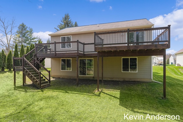 back of property with stairs, a yard, and a deck