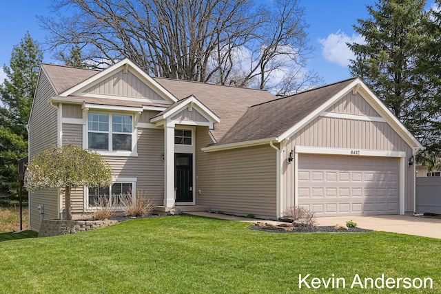 view of front of property featuring a front yard, roof with shingles, board and batten siding, concrete driveway, and an attached garage