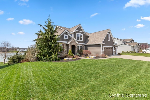 craftsman inspired home featuring stone siding, a garage, board and batten siding, a front yard, and driveway