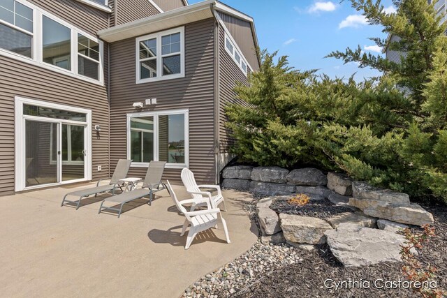 view of patio featuring a fire pit