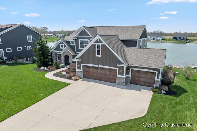 craftsman-style home with board and batten siding, an attached garage, concrete driveway, and stone siding
