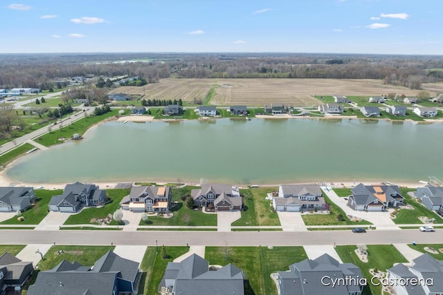 drone / aerial view with a residential view and a water view