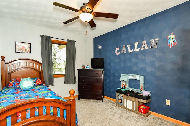 bedroom featuring carpet floors, a ceiling fan, and baseboards