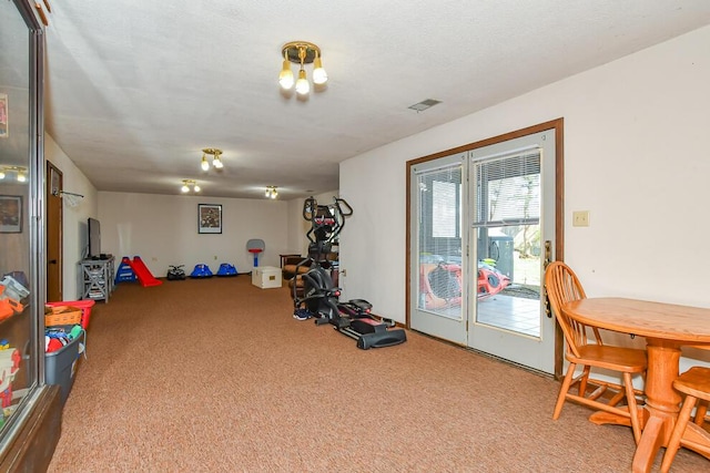 playroom featuring visible vents and carpet