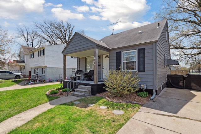 bungalow-style house featuring covered porch, roof with shingles, and a front lawn