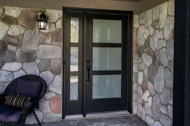 1229 Poppy Hill Dr, Oxford, MI 48371 - doorway to property featuring stone siding