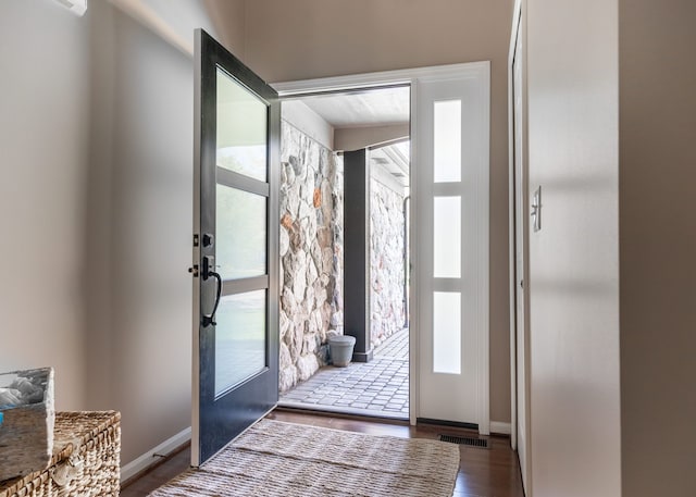 1229 Poppy Hill Dr, Oxford, MI 48371 - entryway with baseboards, french doors, wood finished floors, and visible vents