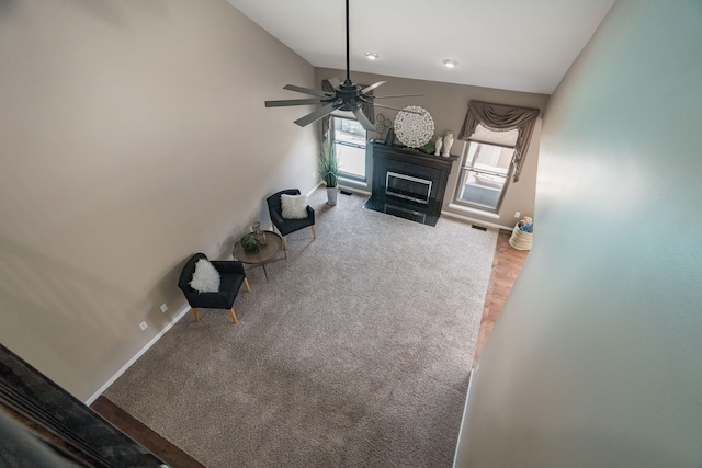 1229 Poppy Hill Dr, Oxford, MI 48371 - unfurnished living room featuring baseboards, a fireplace, a ceiling fan, and lofted ceiling