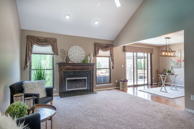 1229 Poppy Hill Dr, Oxford, MI 48371 - living room featuring baseboards, carpet flooring, high vaulted ceiling, and a premium fireplace