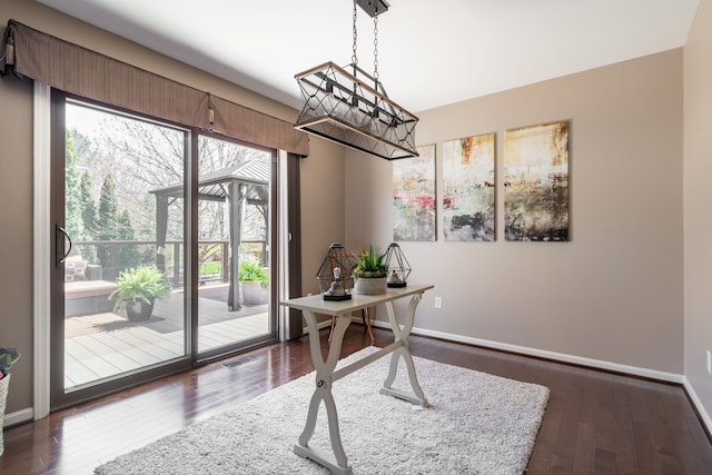 1229 Poppy Hill Dr, Oxford, MI 48371 - office area featuring baseboards, visible vents, dark wood-style floors, and a wealth of natural light