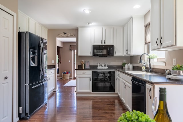 1229 Poppy Hill Dr, Oxford, MI 48371 - kitchen featuring wine cooler, dark countertops, black appliances, and a sink