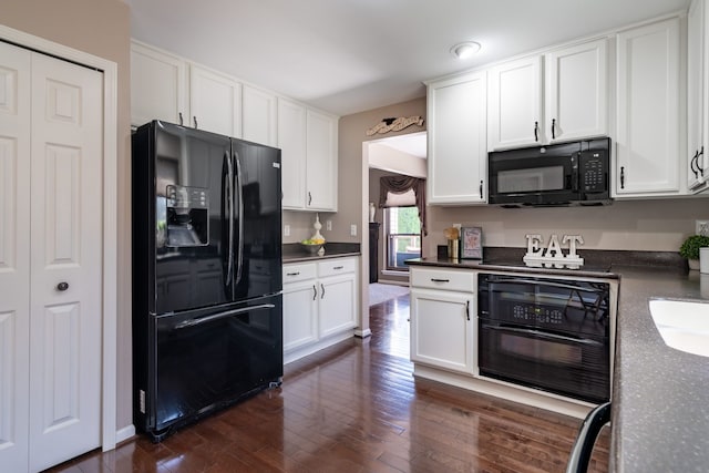 1229 Poppy Hill Dr, Oxford, MI 48371 - kitchen featuring white cabinetry, dark countertops, black appliances, and dark wood-type flooring