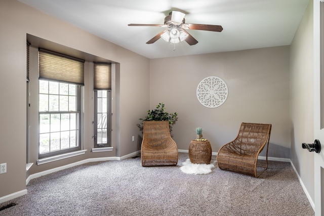 1229 Poppy Hill Dr, Oxford, MI 48371 - living area featuring baseboards, carpet flooring, ceiling fan, and visible vents