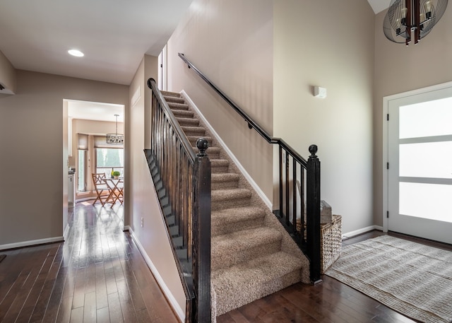 1229 Poppy Hill Dr, Oxford, MI 48371 - stairs featuring wood-type flooring, recessed lighting, baseboards, and a chandelier