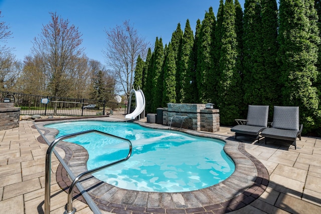 1229 Poppy Hill Dr, Oxford, MI 48371 - view of swimming pool with a patio, fence, a fenced in pool, and a water slide