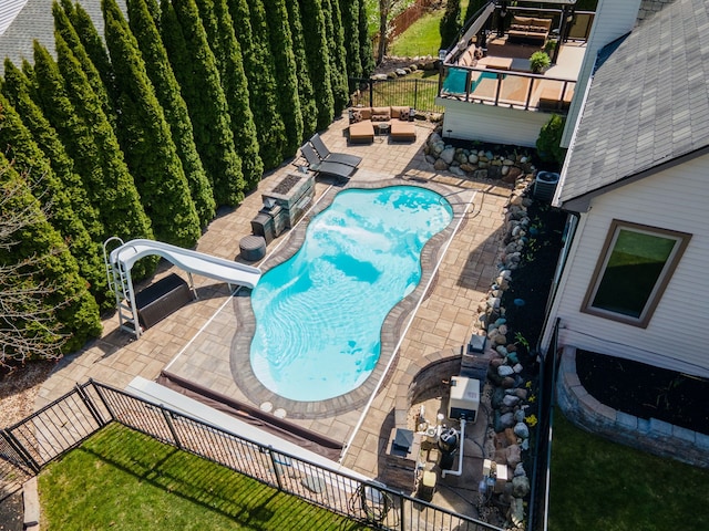 1229 Poppy Hill Dr, Oxford, MI 48371 - view of pool featuring outdoor lounge area, a fenced backyard, a fenced in pool, a patio area, and a water slide