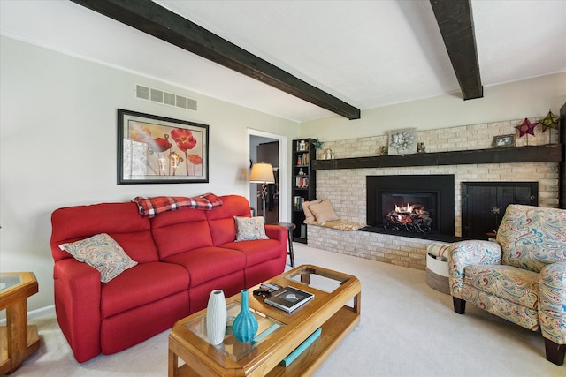 carpeted living room featuring visible vents, beam ceiling, and a fireplace