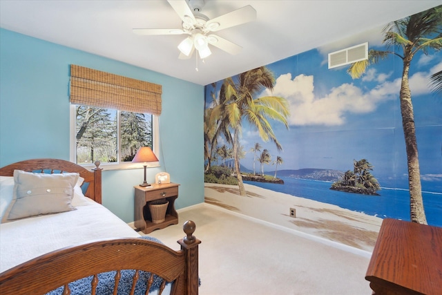 carpeted bedroom with a water view, ceiling fan, and visible vents