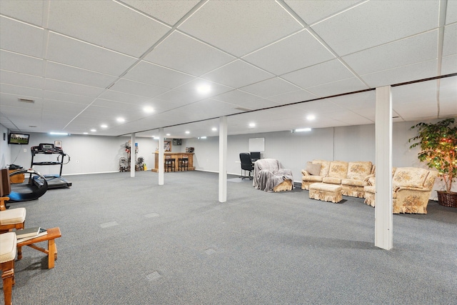 finished basement featuring recessed lighting, a drop ceiling, carpet flooring, and visible vents