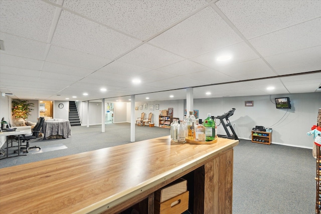 bar with carpet floors, stairs, recessed lighting, baseboards, and a drop ceiling