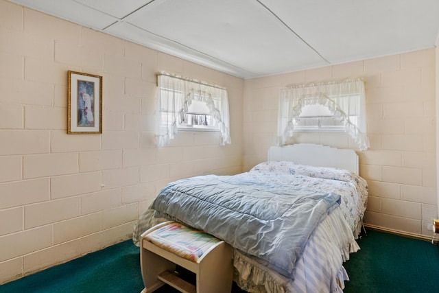 bedroom with dark colored carpet