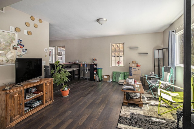 living room featuring visible vents and wood finished floors