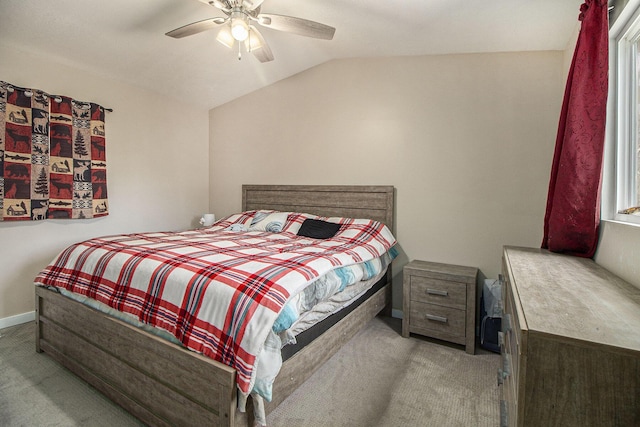 carpeted bedroom featuring baseboards, ceiling fan, and lofted ceiling
