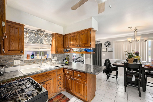 18643 Bittersweet, Fraser, MI 48026 - kitchen featuring brown cabinetry, decorative backsplash, and dark countertops