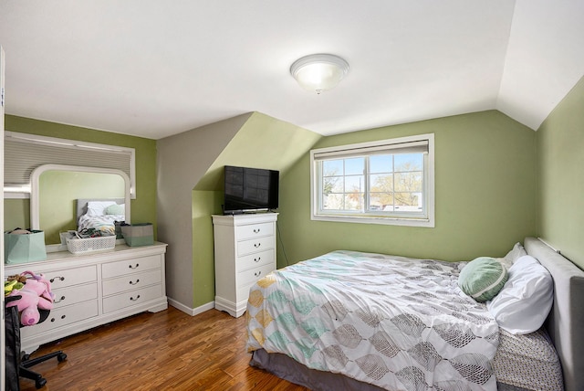 18643 Bittersweet, Fraser, MI 48026 - bedroom with vaulted ceiling, dark wood-style floors, and baseboards