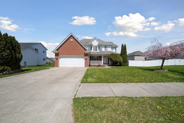 61 Old Carriage Ln, Lapeer, MI 48446 - traditional home featuring concrete driveway, fence, a front yard, and a garage