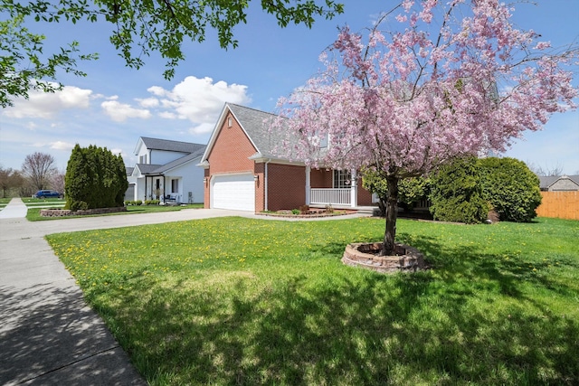 61 Old Carriage Ln, Lapeer, MI 48446 - view of front of house with a garage, driveway, brick siding, and a front yard