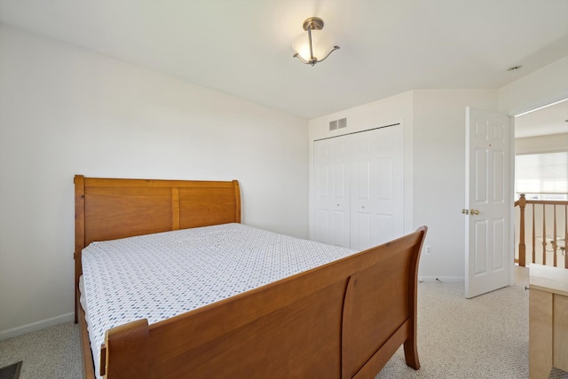 61 Old Carriage Ln, Lapeer, MI 48446 - bedroom with visible vents, baseboards, a closet, and light colored carpet