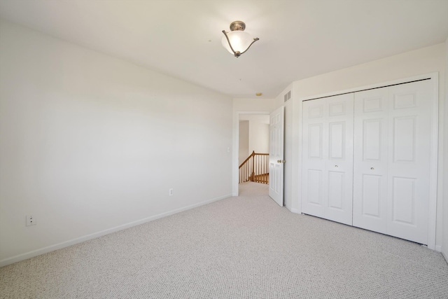 61 Old Carriage Ln, Lapeer, MI 48446 - unfurnished bedroom with baseboards, carpet flooring, visible vents, and a closet