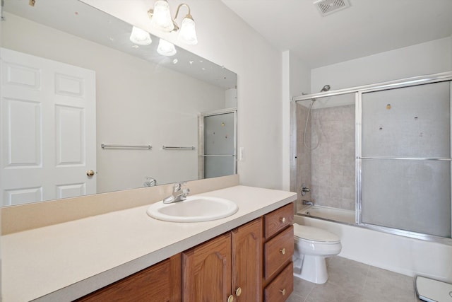 61 Old Carriage Ln, Lapeer, MI 48446 - full bathroom with visible vents, tile patterned flooring, vanity, shower / bath combination with glass door, and toilet